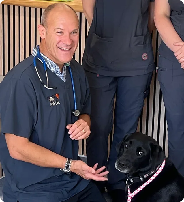 Paul Irvine-Smith with a black labrador