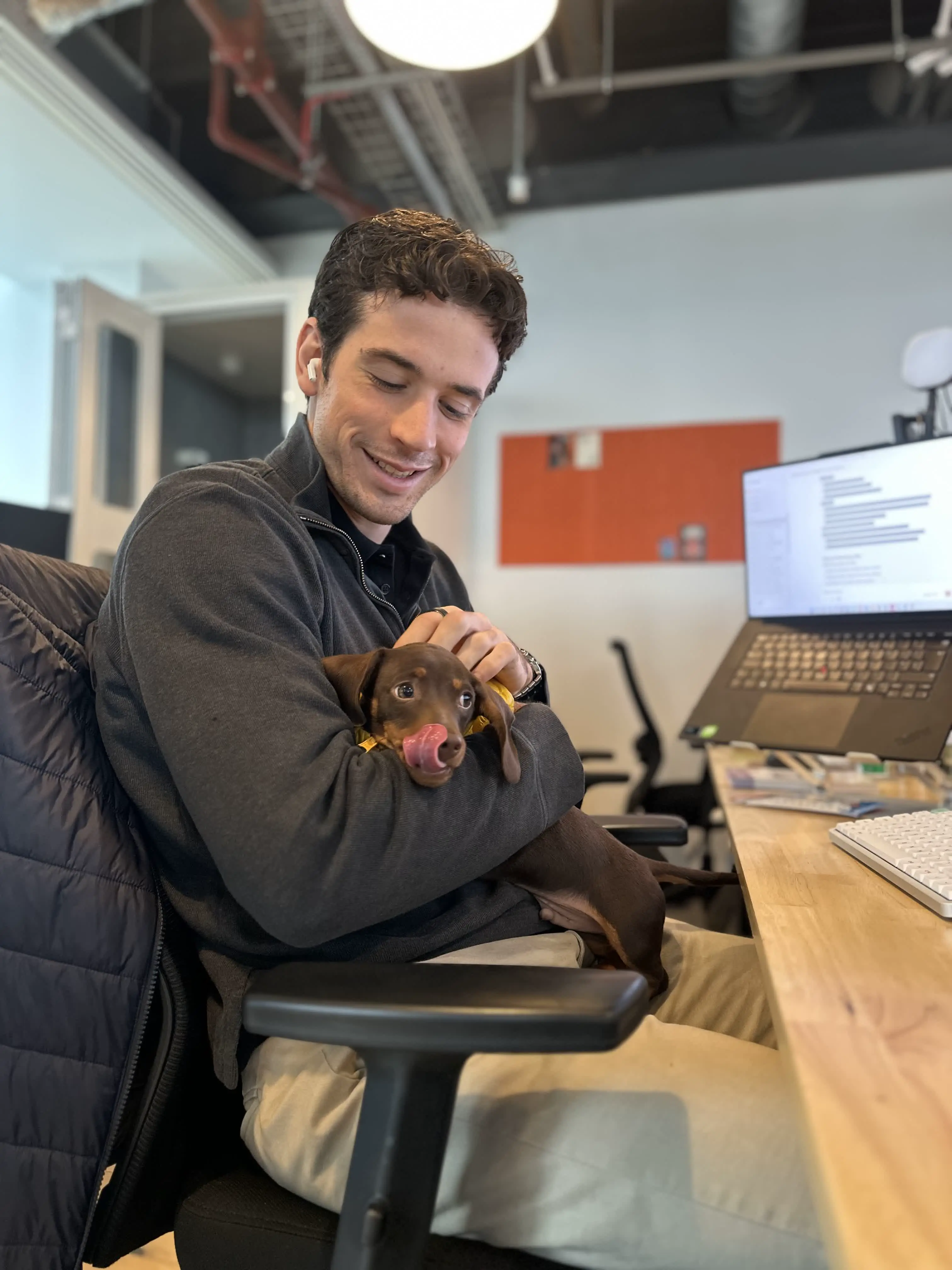 Team member with an office dog